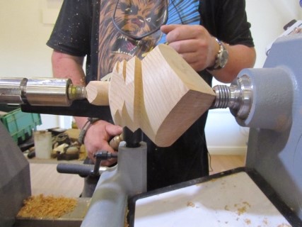 Project no 3 A tri corn bowl from a cedar cube. Here a here a holding spigot being turned